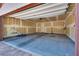Spacious garage featuring ample storage room and a door leading to the inside of the home at 345 Gracious Way, Henderson, NV 89011