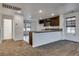 Kitchen area with a bar and granite counters open to the living area at 345 Gracious Way, Henderson, NV 89011