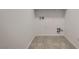 Functional laundry room with tile floors, connections, and electrical outlets at 345 Gracious Way, Henderson, NV 89011