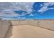 Spacious rooftop patio with stucco walls under a blue sky at 345 Gracious Way, Henderson, NV 89011
