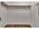 A walk-in closet with carpet floors and a wooden rail for storage at 345 Gracious Way, Henderson, NV 89011