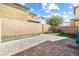 Backyard with paved patio and artificial turf at 3532 Carisbrook Dr, North Las Vegas, NV 89081