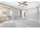 Bedroom featuring gray carpet, gray walls, crown molding, and glass sliding doors to a balcony at 3532 Carisbrook Dr, North Las Vegas, NV 89081