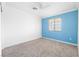 Inviting bedroom with new carpet, white trim, and a blue accent wall at 3532 Carisbrook Dr, North Las Vegas, NV 89081