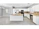 Open-concept kitchen featuring granite countertops, stainless steel appliances, and updated cabinetry at 3532 Carisbrook Dr, North Las Vegas, NV 89081