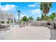 Spacious backyard with a built-in grill, fireplace, pergola, and outdoor seating area perfect for entertaining at 3592 N Campbell Rd, Las Vegas, NV 89129