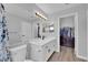 Bright bathroom featuring a large mirror, vanity, and closet access at 3592 N Campbell Rd, Las Vegas, NV 89129