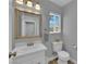 This half bathroom features a mirror, toilet, and sink at 3592 N Campbell Rd, Las Vegas, NV 89129