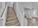 Bright entryway featuring wood-look floors and staircase leading to the upper level of the home at 3592 N Campbell Rd, Las Vegas, NV 89129