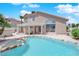 Home exterior featuring a private pool, patio with pergola, and well-maintained landscaping for outdoor enjoyment at 3592 N Campbell Rd, Las Vegas, NV 89129