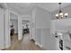 Open hallway space with wood-look floors and access to a bedroom and office area at 3592 N Campbell Rd, Las Vegas, NV 89129