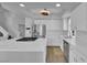 This spacious kitchen has stainless steel appliances, a large island, and bright, white cabinets at 3592 N Campbell Rd, Las Vegas, NV 89129