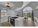 Modern kitchen with white cabinets, quartz countertops, and stainless steel appliances at 3592 N Campbell Rd, Las Vegas, NV 89129