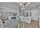 Bright kitchen features an island, stainless steel appliances, white cabinets, and a chandelier at 3592 N Campbell Rd, Las Vegas, NV 89129