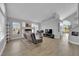 Bright living room with a fireplace, large windows, and open floor plan at 3592 N Campbell Rd, Las Vegas, NV 89129