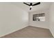 Bedroom with updated flooring, a ceiling fan, and a bright window view at 3667 Mckinley Ave, Las Vegas, NV 89121