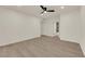 Spacious bedroom featuring updated flooring, a ceiling fan and ensuite bathroom at 3667 Mckinley Ave, Las Vegas, NV 89121