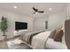 Stylishly furnished bedroom featuring updated flooring, and ensuite bathroom at 3667 Mckinley Ave, Las Vegas, NV 89121