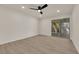 Bright bedroom with new flooring, sliding glass door to outdoor patio at 3667 Mckinley Ave, Las Vegas, NV 89121