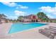 Inviting community pool with lounge chairs for relaxing and enjoying the outdoors at 3667 Mckinley Ave, Las Vegas, NV 89121