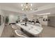 Elegant dining room with a marble table, seating for six, and an open floor plan at 3667 Mckinley Ave, Las Vegas, NV 89121