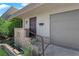Entryway featuring a well-manicured lawn, an inviting front door, and an attached garage at 3667 Mckinley Ave, Las Vegas, NV 89121