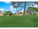 Expansive green space in community with mature trees and landscaping at 3667 Mckinley Ave, Las Vegas, NV 89121