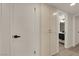 Hallway featuring fresh white walls and doors, black hardware, and a wooden-look floor at 3667 Mckinley Ave, Las Vegas, NV 89121
