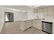 Modern kitchen featuring stainless appliances, quartz countertops, eat-in bar, and wood flooring at 3667 Mckinley Ave, Las Vegas, NV 89121