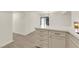 Contemporary kitchen with an eat-in island, stainless steel appliances, and bright lighting at 3667 Mckinley Ave, Las Vegas, NV 89121