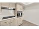 Bright kitchen featuring modern appliances, sleek countertops, and stylish cabinetry with gold hardware at 3667 Mckinley Ave, Las Vegas, NV 89121