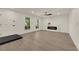Bright living room with hardwood floors, fireplace, large windows with natural light, and contemporary ceiling fan at 3667 Mckinley Ave, Las Vegas, NV 89121