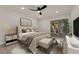A beautifully staged bedroom with a ceiling fan and sliding glass doors to the outside at 3667 Mckinley Ave, Las Vegas, NV 89121