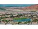 Elevated view showcasing the community with a pond and surrounding houses at 38 Costa Tropical Dr, Henderson, NV 89011