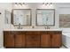 Bathroom features dual vanities, framed mirrors and granite countertops at 38 Costa Tropical Dr, Henderson, NV 89011