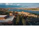 Stunning lakeside resort featuring beautiful architecture, palm trees, and ample parking with scenic mountain views at 38 Costa Tropical Dr, Henderson, NV 89011