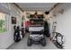 Well-organized garage with ample storage, a golf cart, and natural light, providing both functionality and style at 38 Costa Tropical Dr, Henderson, NV 89011