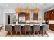 Spacious kitchen with a large island, stainless steel appliances, and stylish pendant lighting at 38 Costa Tropical Dr, Henderson, NV 89011