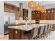 Well-appointed kitchen with modern appliances, large island with seating, and custom cabinetry at 38 Costa Tropical Dr, Henderson, NV 89011