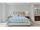 Bright main bedroom with a decorative cross on the wall and ensuite bathroom at 38 Costa Tropical Dr, Henderson, NV 89011