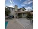 Spacious backyard with a covered patio and well-manicured landscaping and a pool at 390 Rushing Creek Ct, Henderson, NV 89014