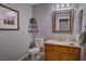 Cozy bathroom features a vanity, mirror and artwork hanging on the wall at 390 Rushing Creek Ct, Henderson, NV 89014