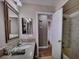 Bright bathroom features a vanity, mirror and shower with bathtub at 390 Rushing Creek Ct, Henderson, NV 89014