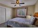 Comfortable bedroom with large window, closet, and ceiling fan at 390 Rushing Creek Ct, Henderson, NV 89014
