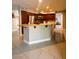 Kitchen featuring wood cabinetry, granite countertops, stainless steel appliances, and breakfast bar at 390 Rushing Creek Ct, Henderson, NV 89014