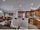 Bright kitchen features stainless steel appliances, wood cabinetry, and adjacent dining area at 390 Rushing Creek Ct, Henderson, NV 89014