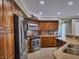 Well-equipped kitchen with stainless steel appliances, ample counter space, and custom cabinetry at 390 Rushing Creek Ct, Henderson, NV 89014