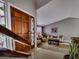 Inviting living room with high ceilings, large front door, and ample natural light at 390 Rushing Creek Ct, Henderson, NV 89014
