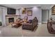 Cozy living room featuring a fireplace, tile flooring, and comfortable seating at 390 Rushing Creek Ct, Henderson, NV 89014