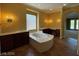 Primary bathroom features a tub and double vanity at 4565 Riva De Romanza St, Las Vegas, NV 89135